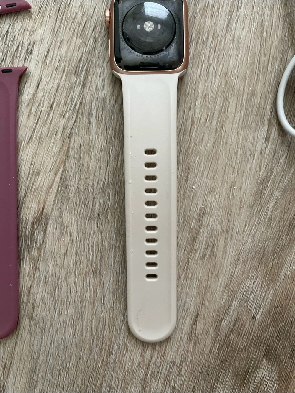 Apple Smartwatch with White, Black, and Mauve Bands